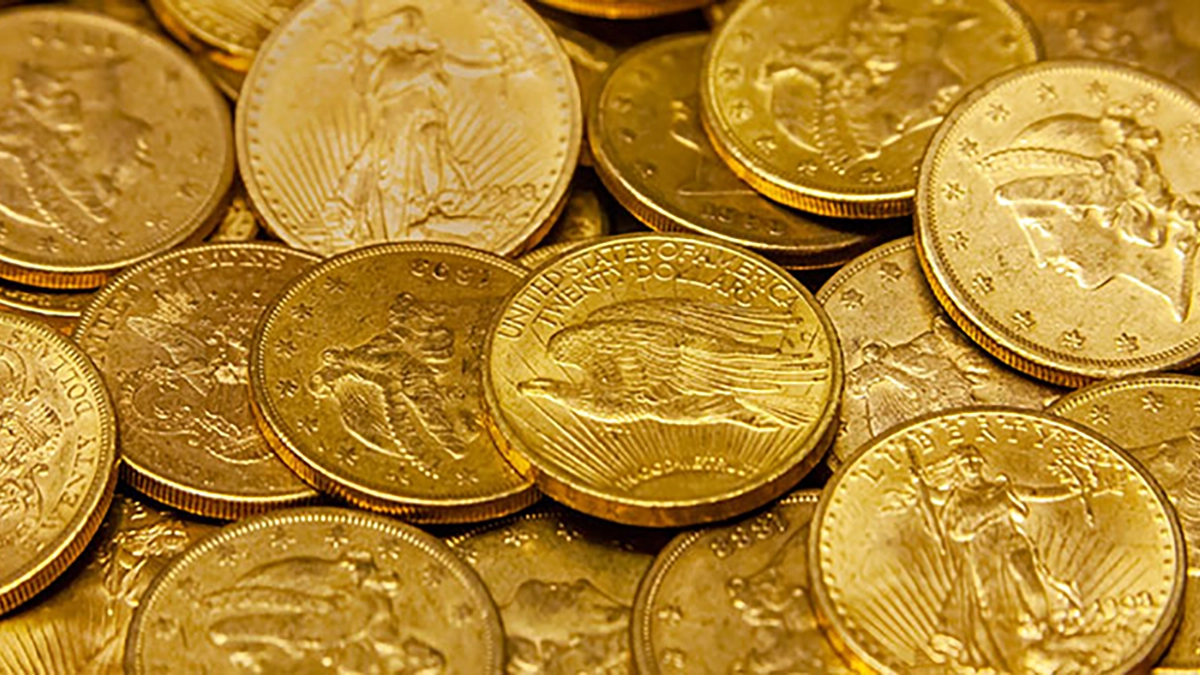 This is a photograph of a pile of United States generic gold coins.