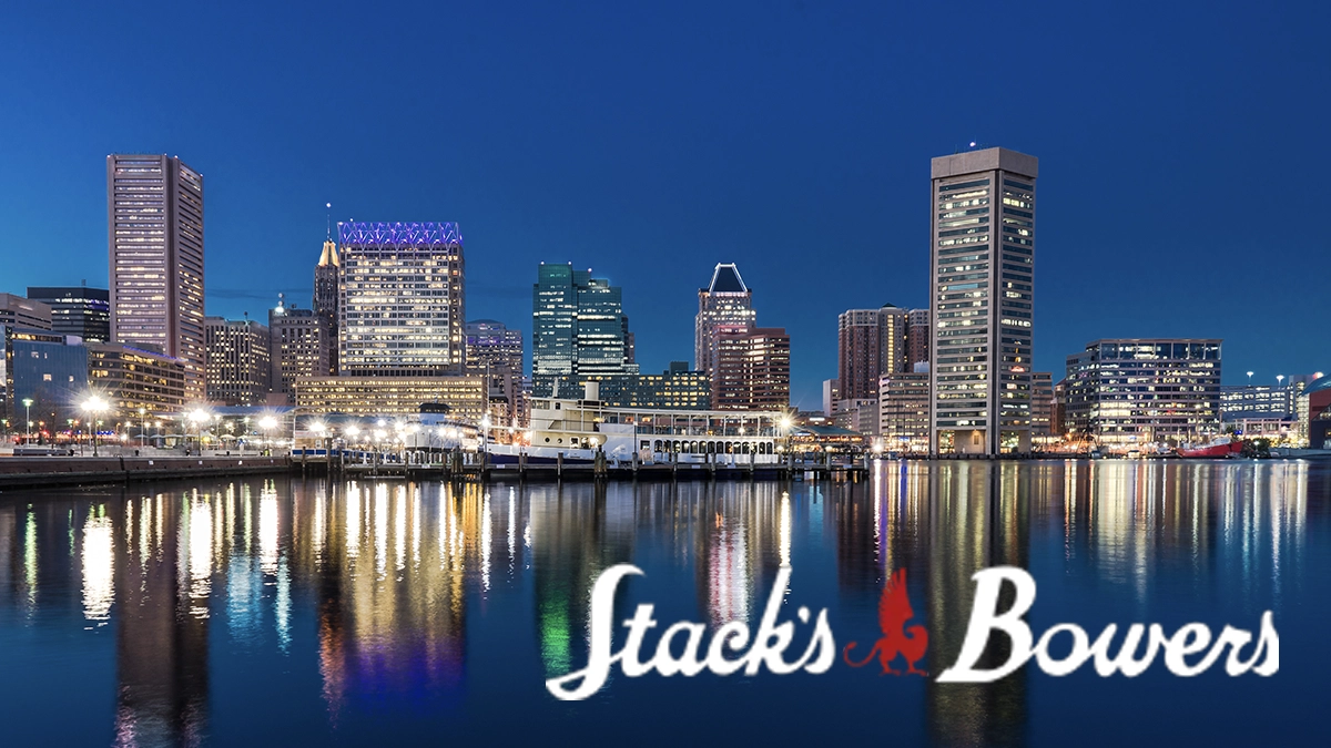 Stack's Bowers logo overlayed on a photo of the city of Baltimore. Image: Adobe Stock / CoinWeek.