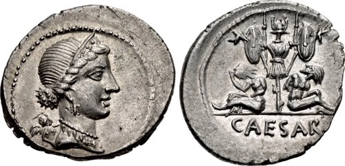 Rome: Republic. The Caesarians. Julius Caesar. Late 46-early 45 BCE. AR Denarius (21mm, 3.36 g, 3h). Military mint traveling with Caesar in Spain. Obverse: Diademed head of Venus right, Cupid at her shoulder behind. Reverse: Trophy of Gallic arms, two seated captives at base, CAESAR in exergue.