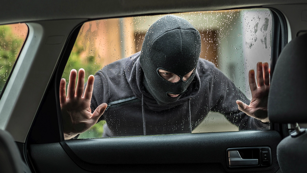 Help NCIC Fight the Recent Surge in Numismatic Crime. A thief prepares to break into a car to steal coins. Image: Adobe Stock.