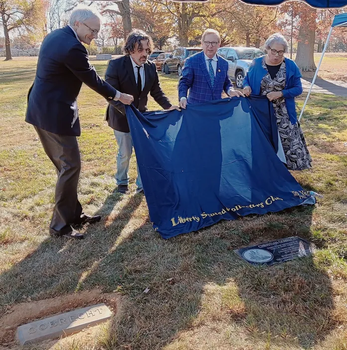 Figure 1. Leonard Augsburger, Joseph Menna, Thomas J. Uram, and Ventris C. Gibson unveil a new graveside memorial headstone for Christian Gobrecht on November 13, 2024 at Lawnview Memorial Park, Rockledge, PA.